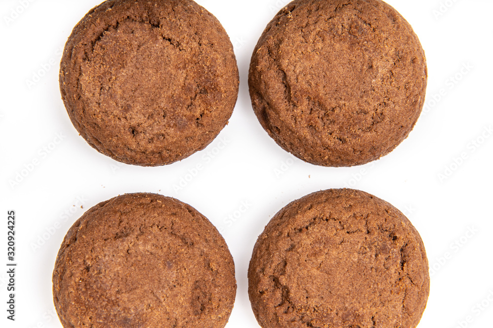 Brown chocolate chip cookies with soft tasty filling inside on a white background Brown chocolate chip cookies with soft tasty filling inside on a white background