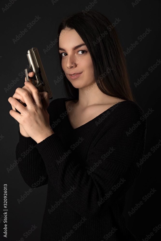 Female assassin with a gun Female assassin with a gun
