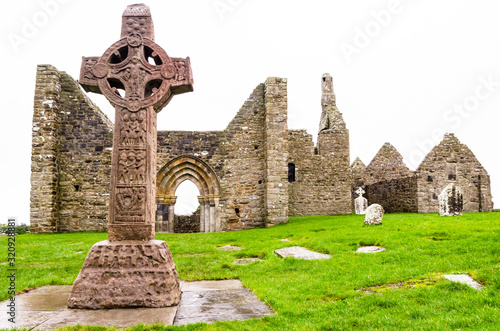 The monastic city of Clonmacnoise with the typical crosses, Ireland photo