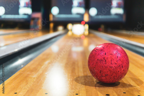 red bowling ball and blur background in bowling playground