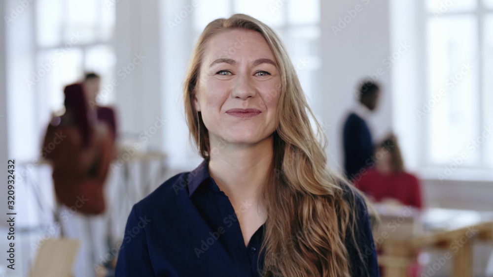 Portrait of happy young confident CEO business woman with blond hair in  formal clothes looking at camera at office. Stock Photo | Adobe Stock