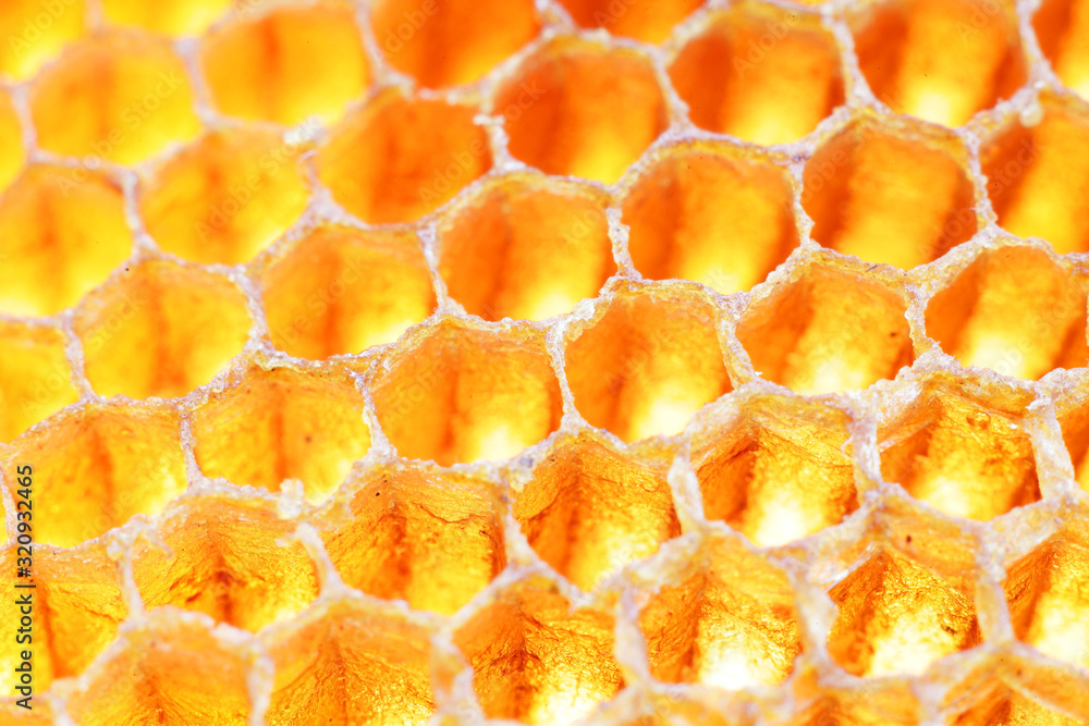 close up golden texture of bee hive background close up golden texture of bee hive background