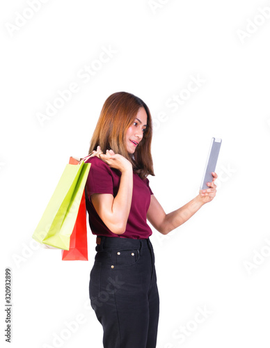 woman holding paper bags green and orange shopping And mobile phone. on white background