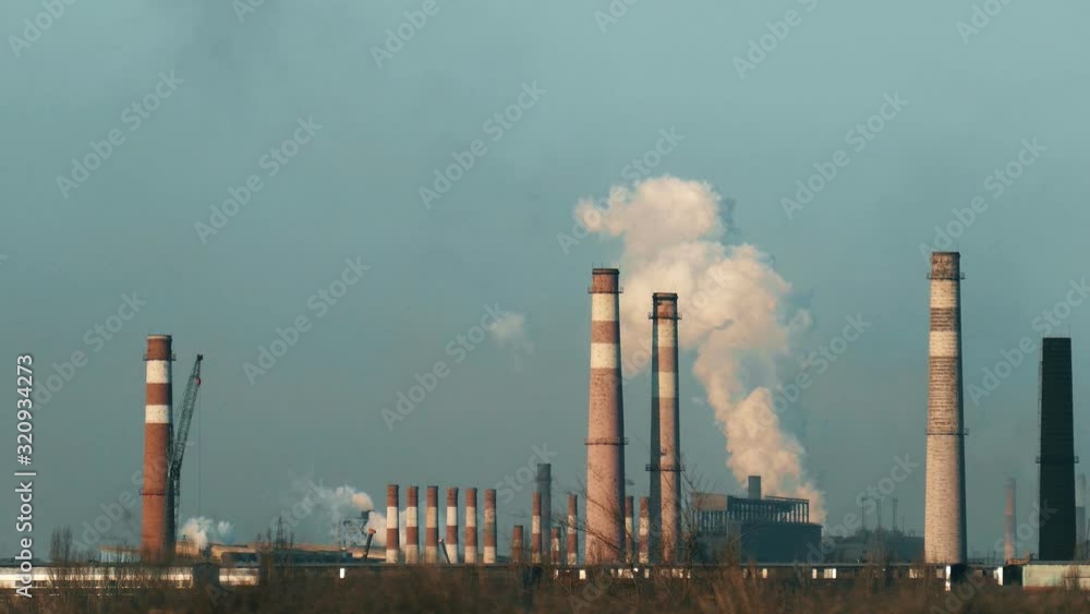 A lot of chimneys. Air pollution. Smoke destroys ozone. Metallurgical factory. Environmental pollution concept. A lot of chimneys. Air pollution. Smoke destroys ozone. Metallurgical factory. Environmental pollution concept.