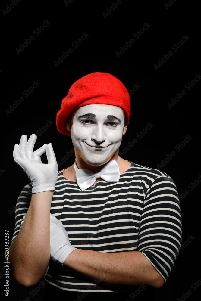 Portrait of smiling male mime on black Portrait of smiling male mime on black