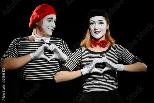 Fotografie Mimes makes heart shapes with hands