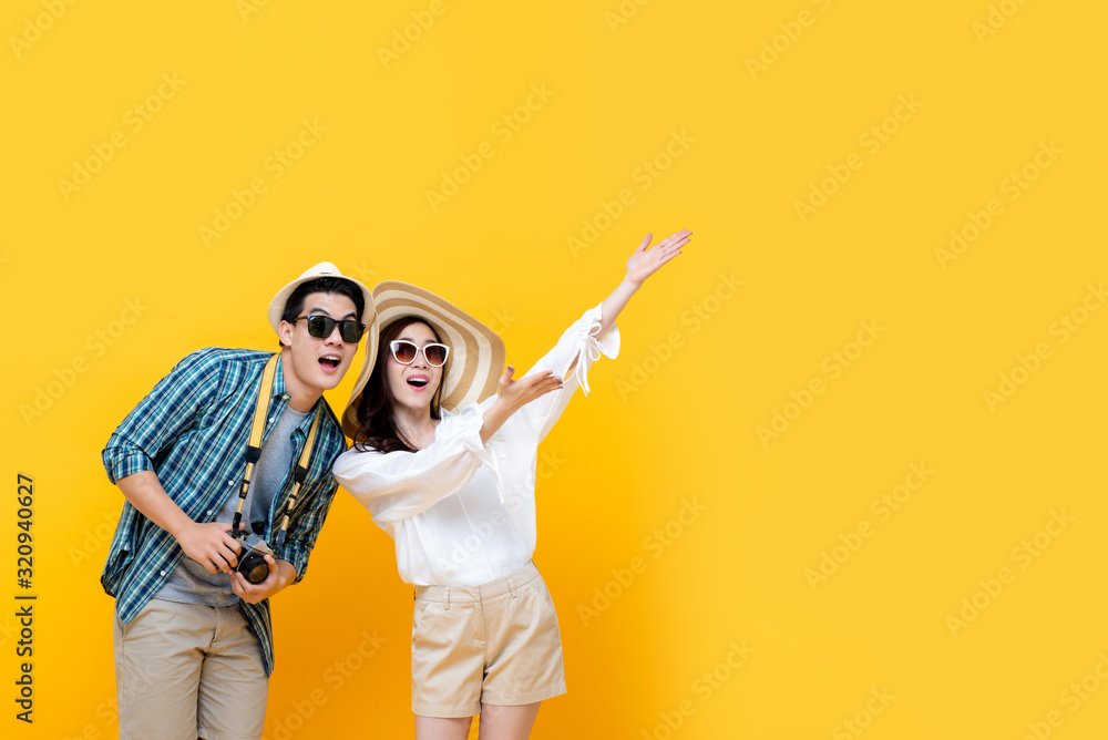 Fototapeta premium Excited smiling lovely Asian tourist couple