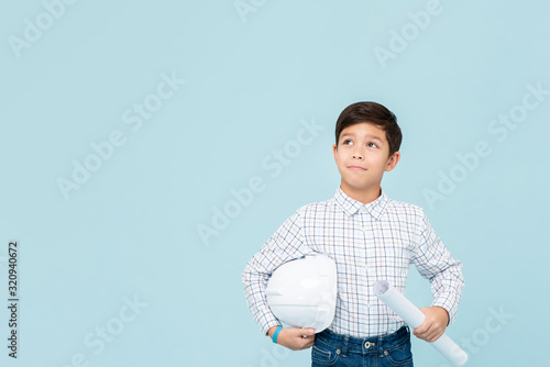 Obraz na plátne Young asian boy aspiring to be future engineer