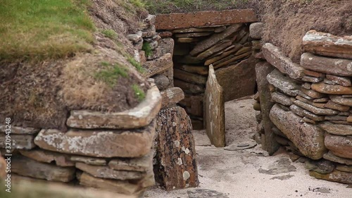 This is a view of a wall section at Skara Brae showing the tightly packed stone construction of the dwellings. photo