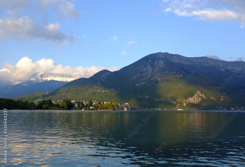Annecy, France - April 28: View of the mountains and Lake Lac d'Annecy at sunset on April 28, 2017 in Annecy, France.