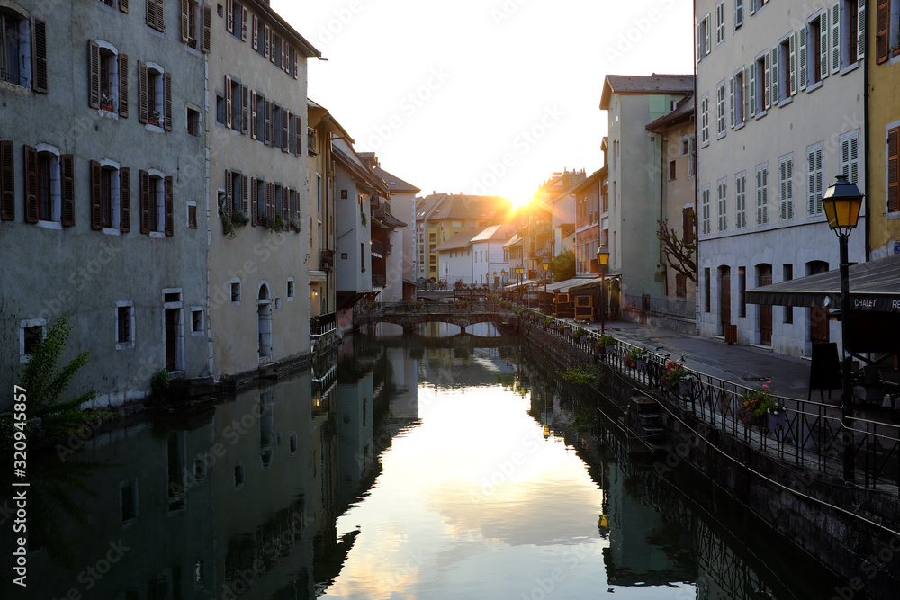 Annecy, France - April 28: Beautiful scenery of the canal with reflections from the surface at sunset on April 28, 2017 in Annecy, France.
