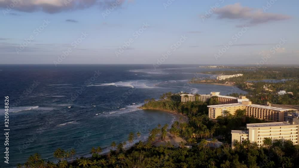 Establishing shot of ocean view and coastal landscape at sunset Establishing shot of ocean view and coastal landscape at sunset