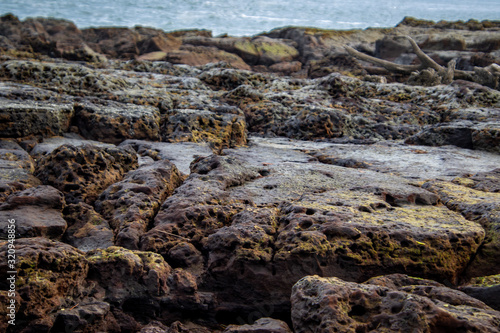 black rocks on the beach
