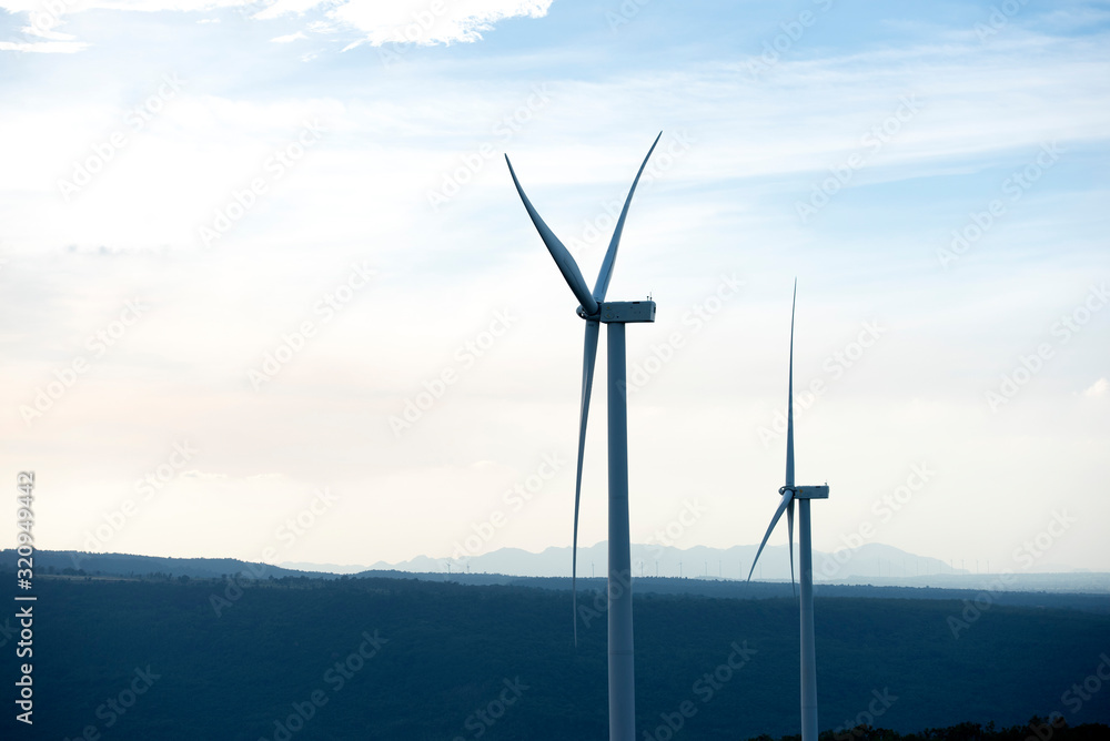 Windmill on the mountain landscape, beautiful summer autumn on the mountain, green energy, create eco-energy Eco wind turbine farm in northern Thailand