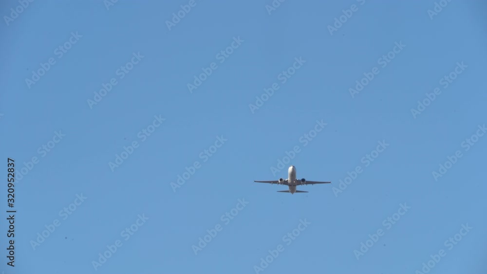 Airplane Flying High Above Through the Sky Toward Arrival at Destination Airplane Flying High Above Through the Sky Toward Arrival at Destination