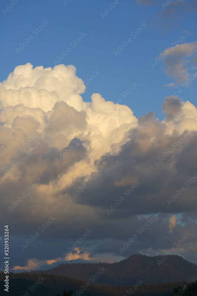 landscape image, large cloud on sky above mountain hill