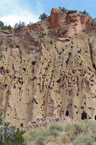 Reconstructed pueblo on cliffs at Bandelier National Monument, New Mexico photo