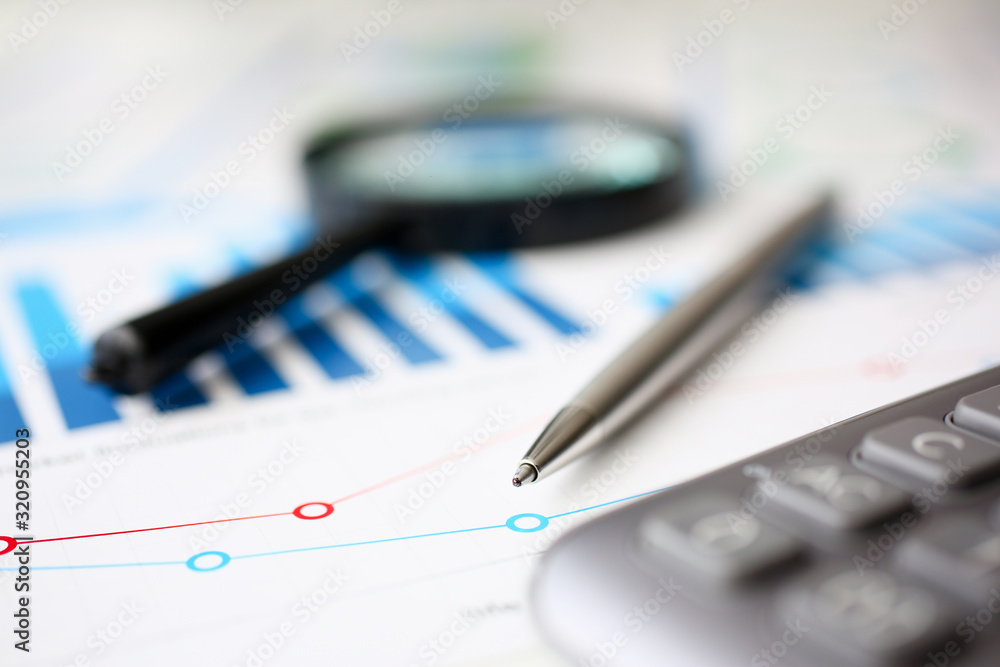 Financial statistics documents ball pen infographics at office table closeup. Internal Revenue Service inspector sum check, investigation, exchange market, earnings, savings, loan and credit concept Financial statistics documents ball pen infographics at office table closeup. Internal Revenue Service inspector sum check, investigation, exchange market, earnings, savings, loan and credit concept