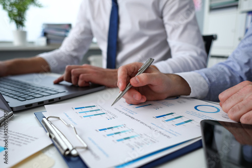 Fotografija Group of people hold in arms financial papers solve and discuss problem closeup