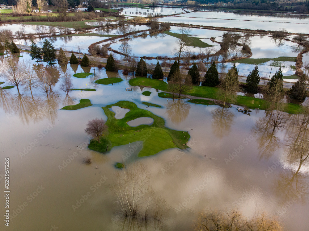 Aerial of mass flooding on golf course after rain storm