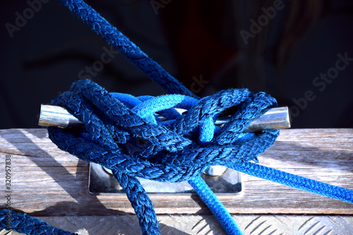 Bright blue rope knot in marina pontone photo