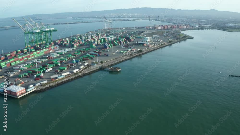 Shipping and logistics industrial area near the bay in the morning. Shipping and logistics industrial area near the bay in the morning.