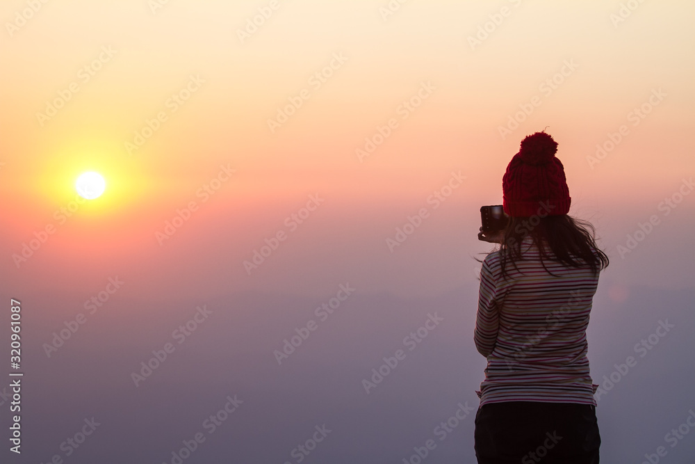 silhouette of the photographer at sunset