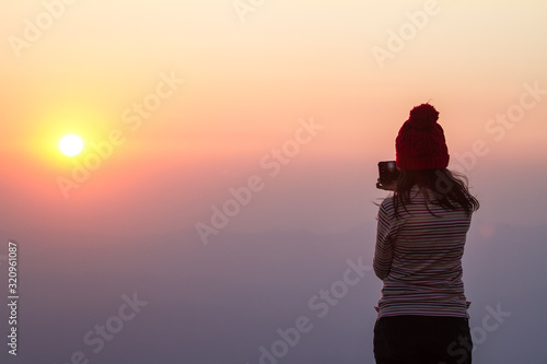 silhouette of the photographer at sunset