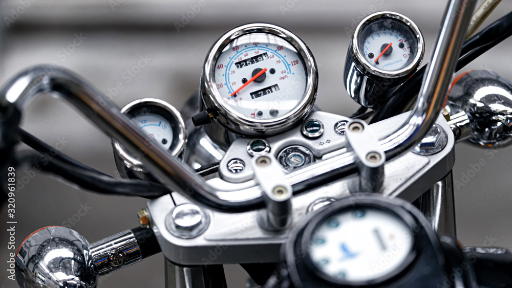 Retro motorcycle speedometer close-up with blurry background Retro motorcycle speedometer close-up with blurry background