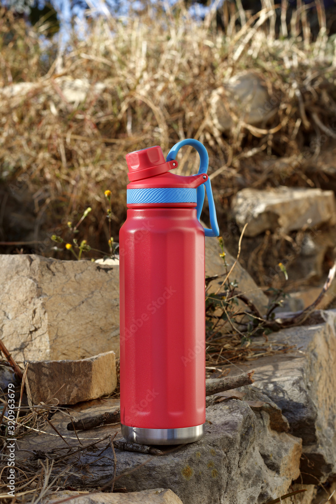 Thermos Bottle and water bottle in outdoor settings. Thermos Bottle and water bottle in outdoor settings.