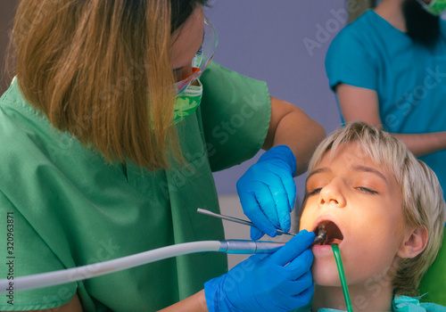 Detailed dental examination on a female patient in the dentist's office