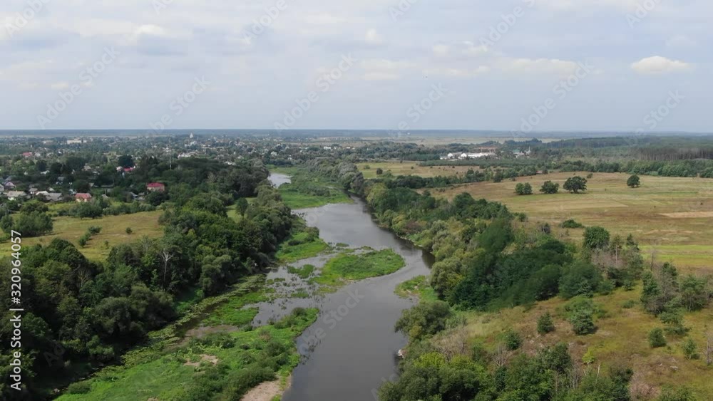 Aerial View of a River Bordered by Fields Outside Small Town in Ukraine Aerial View of a River Bordered by Fields Outside Small Town in Ukraine