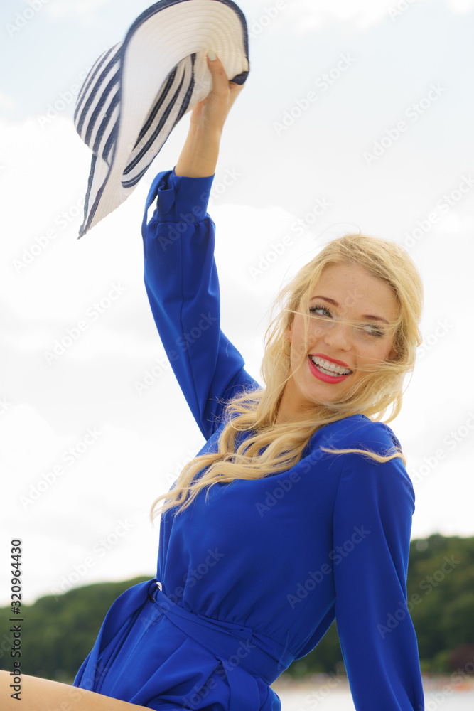 Fashion model wearing blue jumpsuit Fashion model wearing blue jumpsuit
