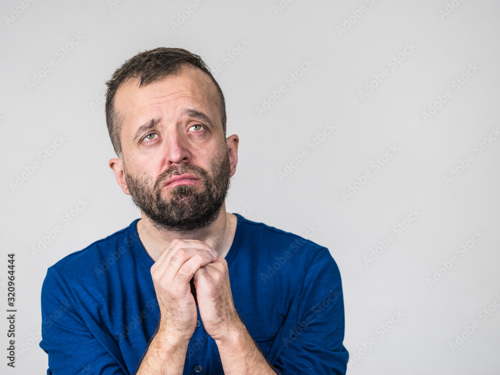 Fototapeta premium Man begging or apologizing