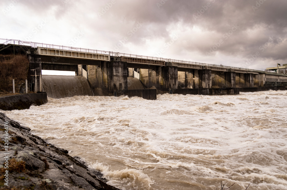 Dam at the river inn after heavy railfall Dam at the river inn after heavy railfall