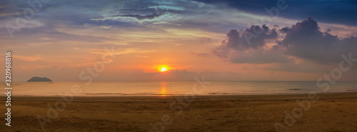 view seaside panorama on sand beach with yellow sun light and cloudy sky background, sunset at Laem Son Beach, Laem Son National Park, Ranong, southern of Thailand.