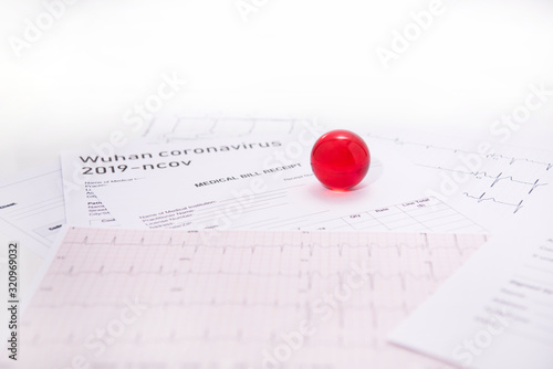 Medicine documents with small red glass balls on it. Abstract photo of illness time.