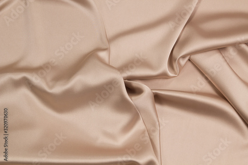 Fabric satin silk drapery. Gold textile