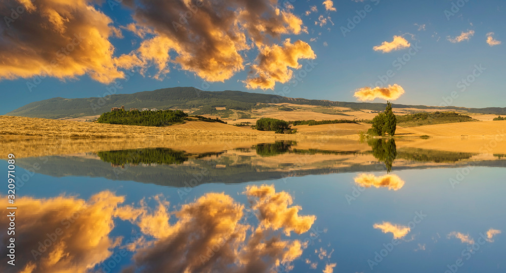 Mountain reflections and clouds in the water