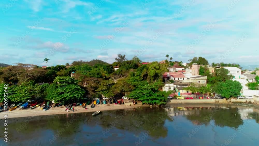 Aerial wide shot of a Fishing Village Beach in Rio de Janeiro, Brazil. Camera moves foward Aerial wide shot of a Fishing Village Beach in Rio de Janeiro, Brazil. Camera moves foward