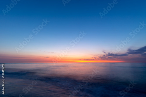 Colourful sky over the north sea after sunset at the beach on Juist  East Frisian Islands  Germany.