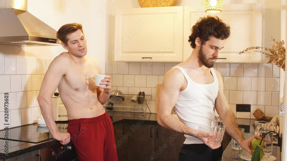 Morning, breakfast. Two young sexy guys in the kitchen. Love and relationships. Morning, breakfast. Two young sexy guys in the kitchen. Love and relationships.