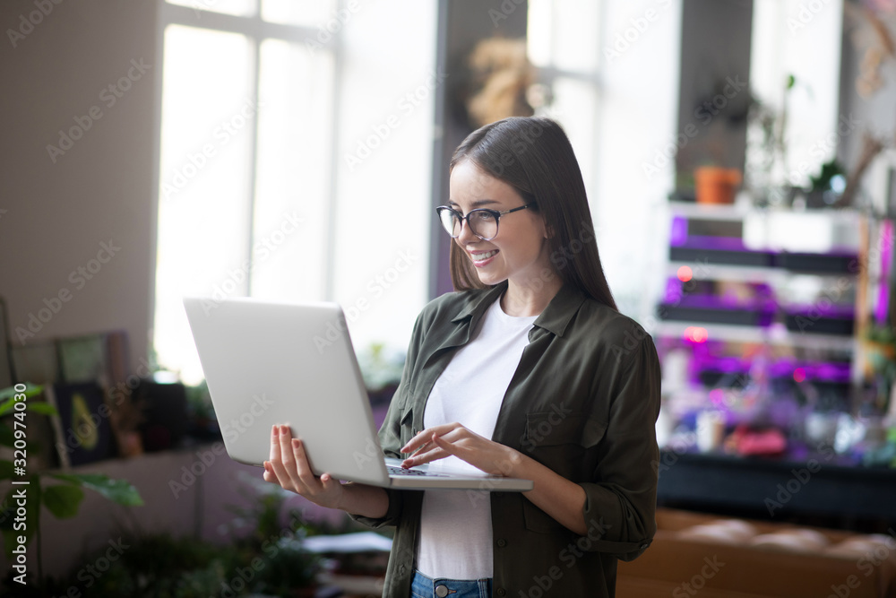 Successful joyful girl with a laptop in her hands. Successful joyful girl with a laptop in her hands.