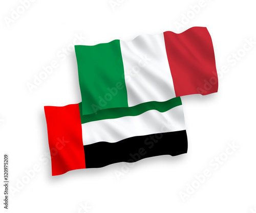 National vector fabric wave flags of Italy and United Arab Emirates isolated on white background. 1 to 2 proportion.