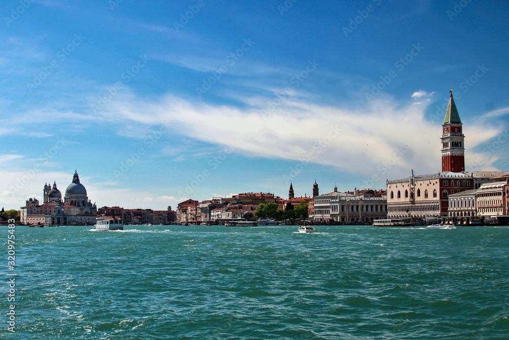 Returning from the island of Lido to the vaporetto, you can see Venice from a completely different angle. Visible landmarks include: the Palazzo Ducale, Basilica di Santa Maria della Salute and others