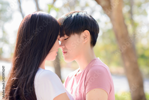 LGBT Asian woman young lesbian lovers kissing on Valentine's Day © Pissanu