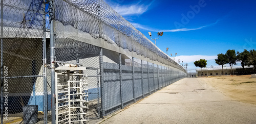 Prison fences and turnstile of Mira Loma Detention Center in Lancaster California.