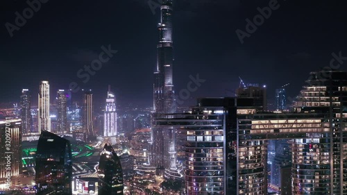 Wallpaper Mural Aerial night illuminated Dubai city skyline skyscrapers view and  busy traffic on Sheikh Zayed road  highway Torontodigital.ca