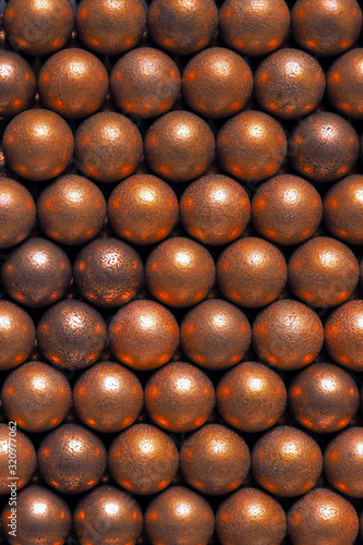 The surface of the many balls for shooting from an air gun. View from above. Background or wallpaper. Vertical shot. Macro