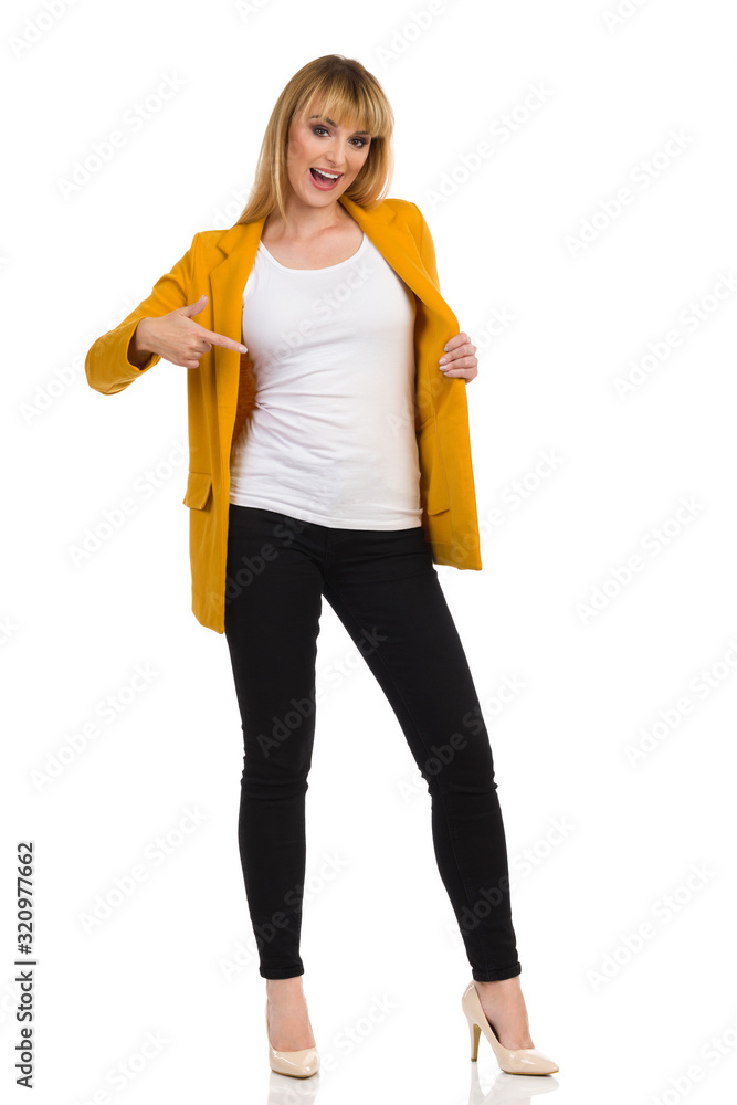 Woman In Yellow Jacket Is Pointig At Herself And Talking Woman In Yellow Jacket Is Pointig At Herself And Talking
